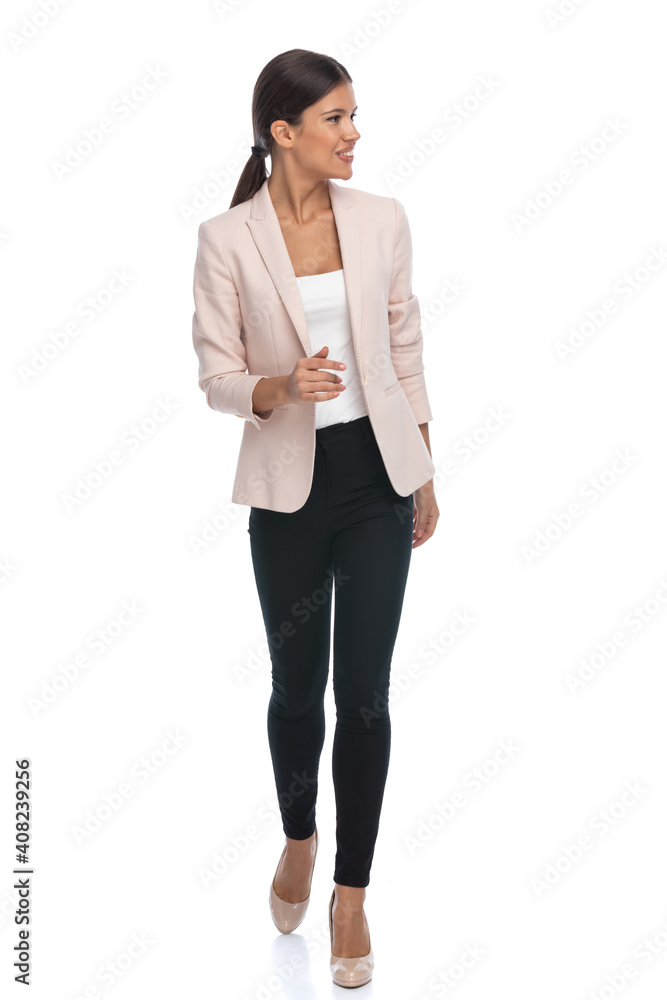 full body picture of smart casual businesswoman looking to side
