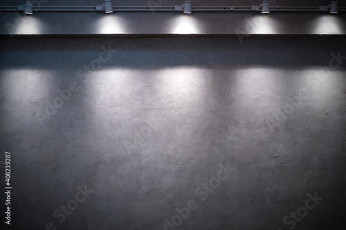 empty Cement wall in dark with ray light from the lamp. Use for abstract background texture banner building room