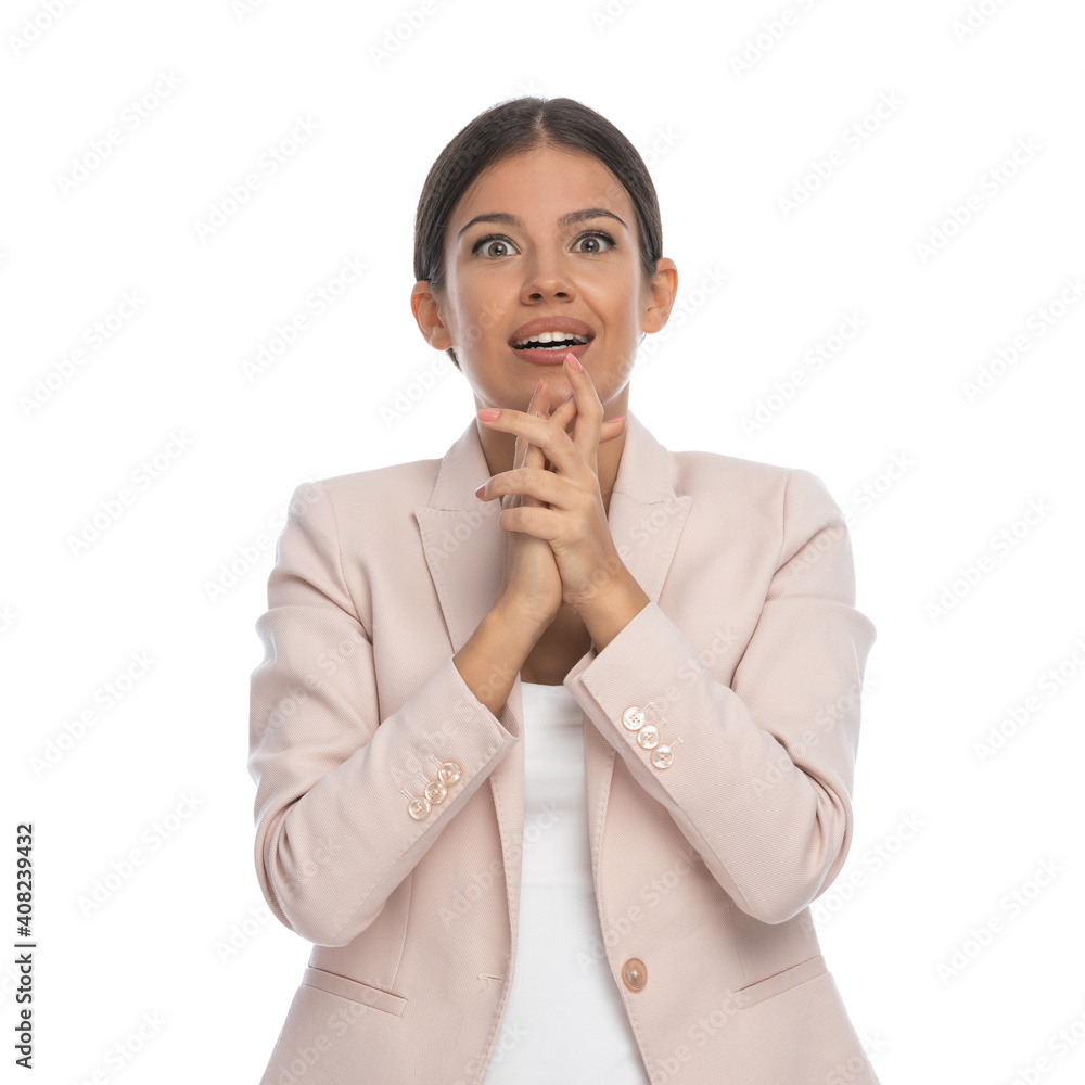 attractive young businessman holding hands together and wishing attractive young businessman holding hands together and wishing