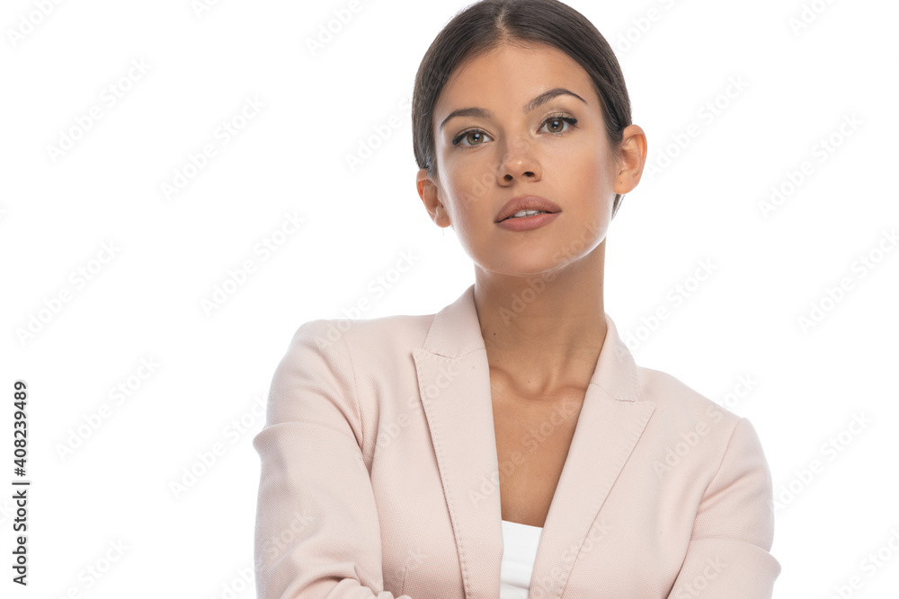 portrait of brunette smart casual woman crossing arms portrait of brunette smart casual woman crossing arms