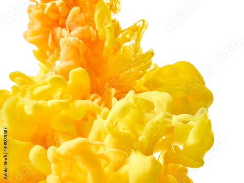 Yellow paint in water over white background