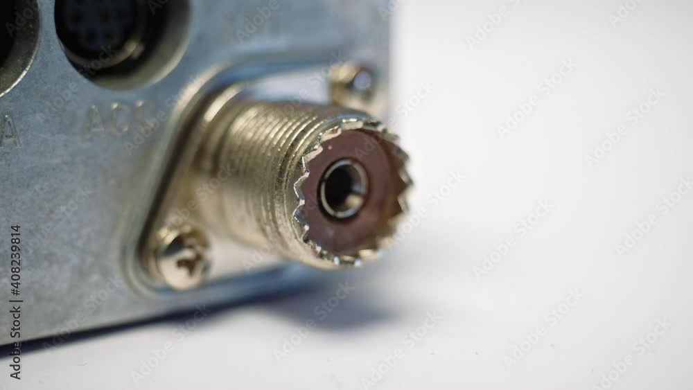 Connecting a coaxial cable to radio equipment close-up Connecting a coaxial cable to radio equipment close-up