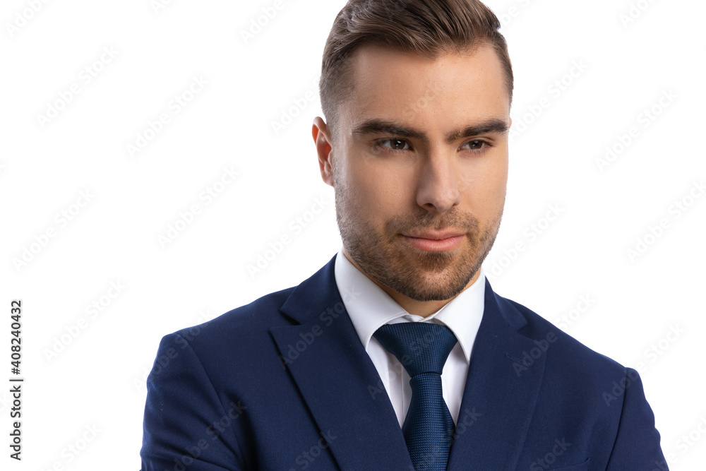 close up of elegant fashion model in navy blue suit looking to side close up of elegant fashion model in navy blue suit looking to side