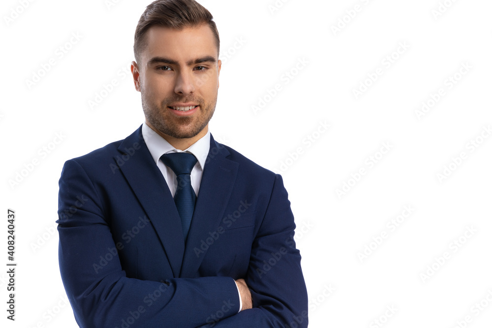 elegant young businessman in navy blue suit crossing arms elegant young businessman in navy blue suit crossing arms