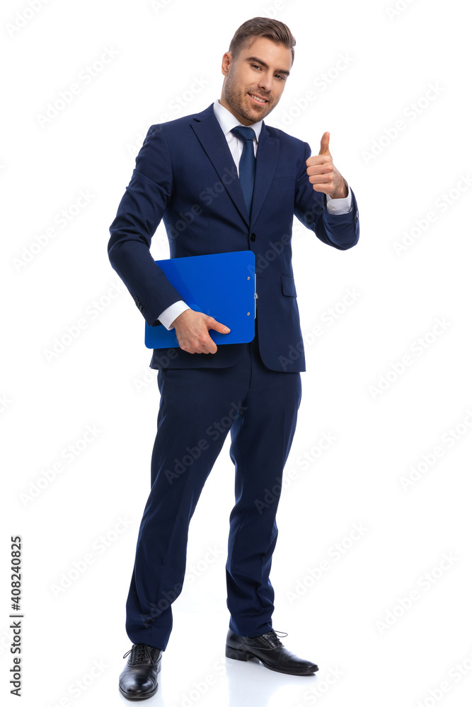 confident businessman making thumbs up gesture and smiling confident businessman making thumbs up gesture and smiling