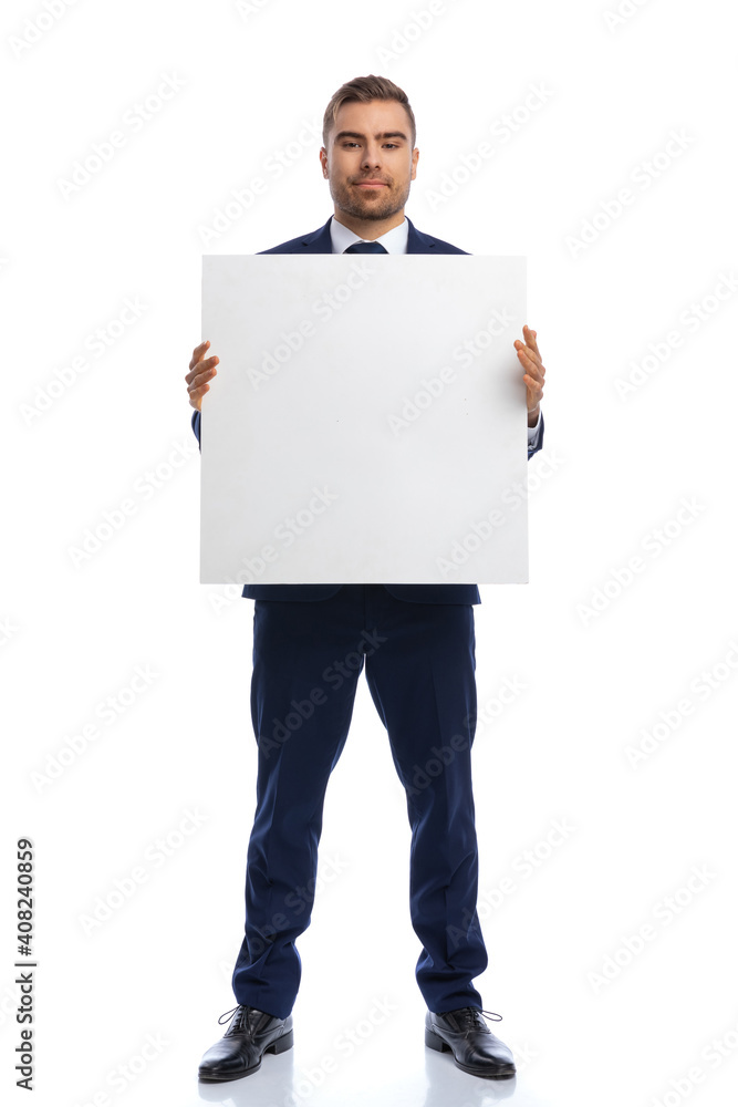 full body picture of proud businessman presenting empty board full body picture of proud businessman presenting empty board