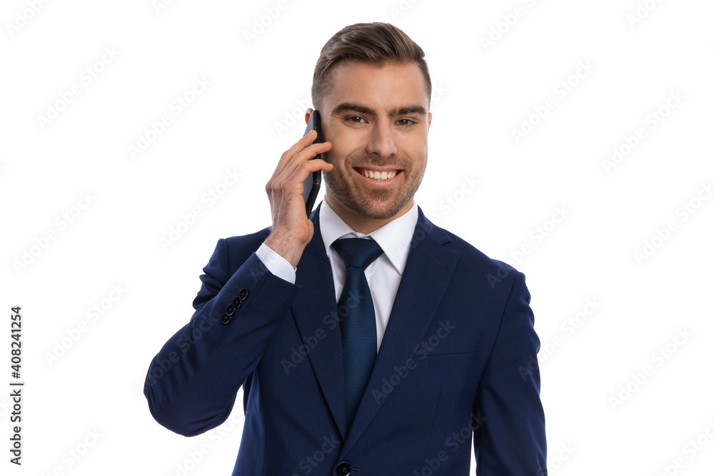 smiling young man talking on the phone smiling young man talking on the phone