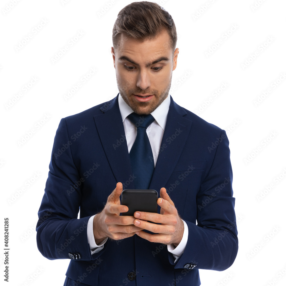 attractive bearded businessman in navy blue suit reading emails attractive bearded businessman in navy blue suit reading emails