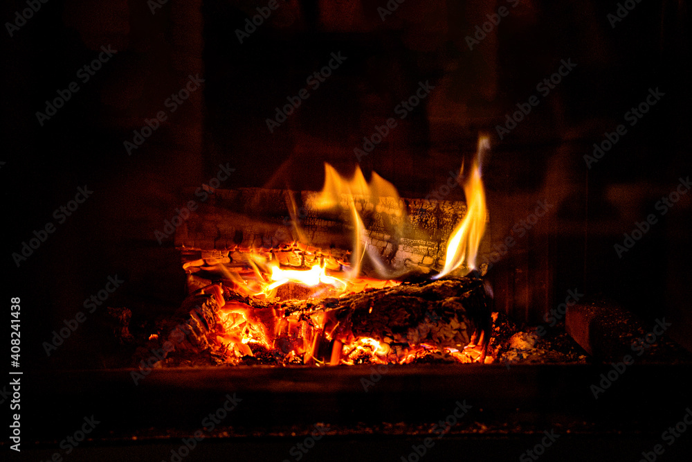 hot fire burning in a domestic fireplace on a winter day hot fire burning in a domestic fireplace on a winter day