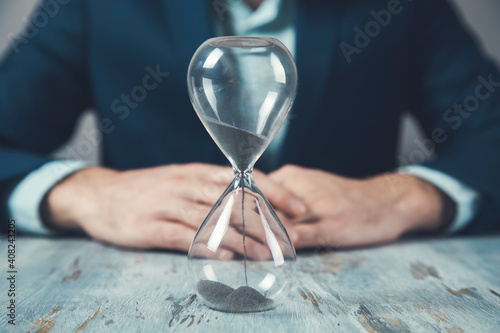 young business man with hourglass