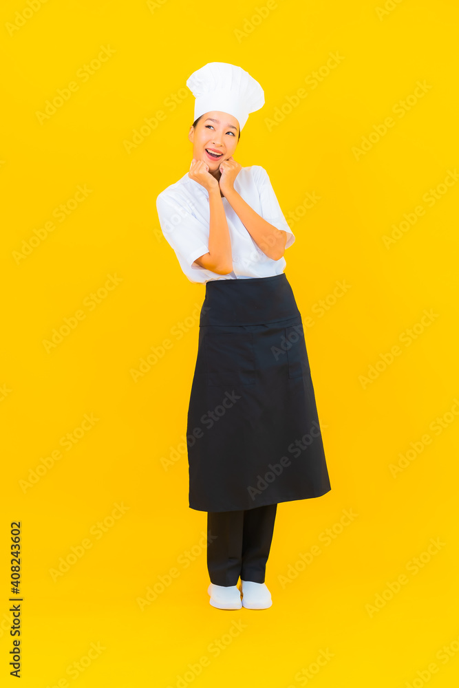 Portrait beautiful young asian woman in chef or cook uniform with hat Portrait beautiful young asian woman in chef or cook uniform with hat