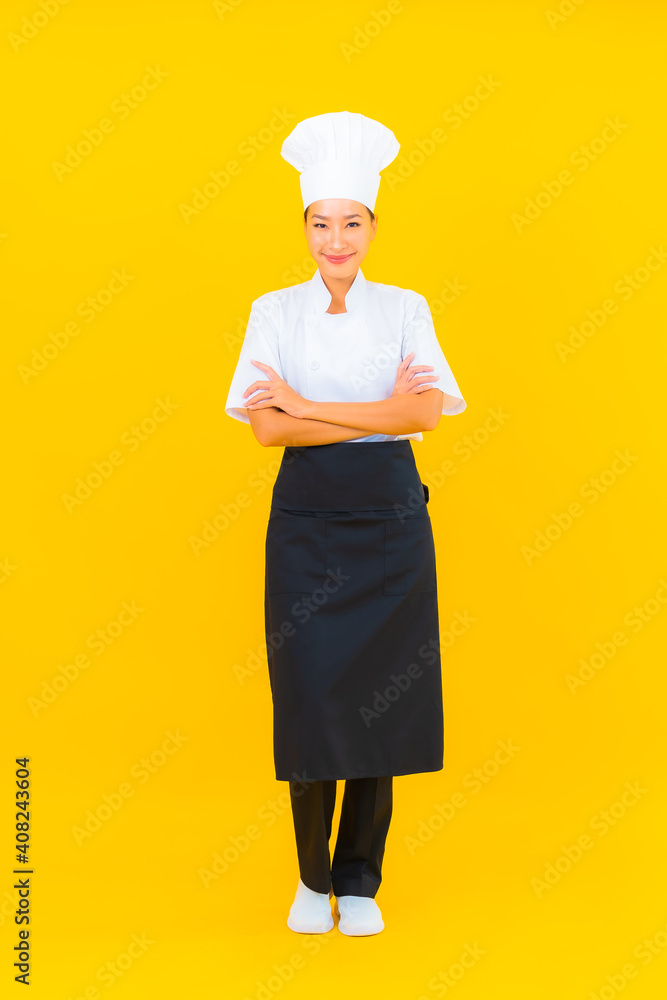 Portrait beautiful young asian woman in chef or cook uniform with hat Portrait beautiful young asian woman in chef or cook uniform with hat