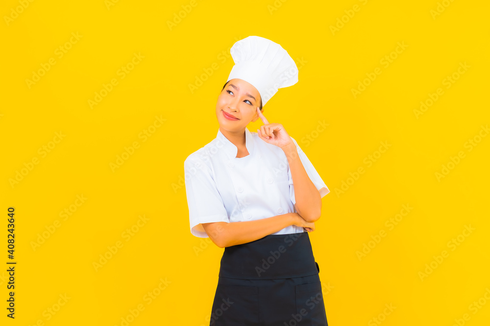 Portrait beautiful young asian woman in chef or cook uniform with hat Portrait beautiful young asian woman in chef or cook uniform with hat
