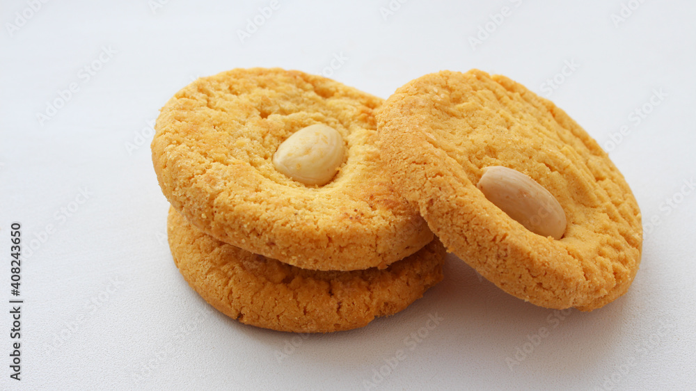 Round whole and half oatmeal cookies with nuts isolated on white background. Sweet cookies. Bakery products. Place for text. Top view. Homemade oatmeal cookies group, selective focus Round whole and half oatmeal cookies with nuts isolated on white background. Sweet cookies. Bakery products. Place for text. Top view. Homemade oatmeal cookies group, selective focus