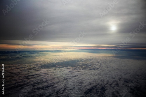 spectacular sunset seen from an airplane with clouds in the foreground and in the distance  © massimo