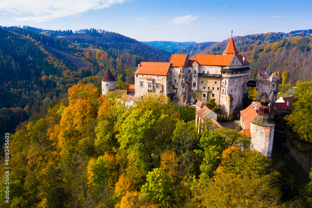 Scenic aerial view of impressive medieval Pernstejn castle on sunny autumn day, South Moravian Region, Czech Republic