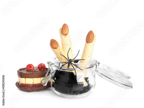 Delicious desserts decorated as monster fingers on white background. Halloween treat