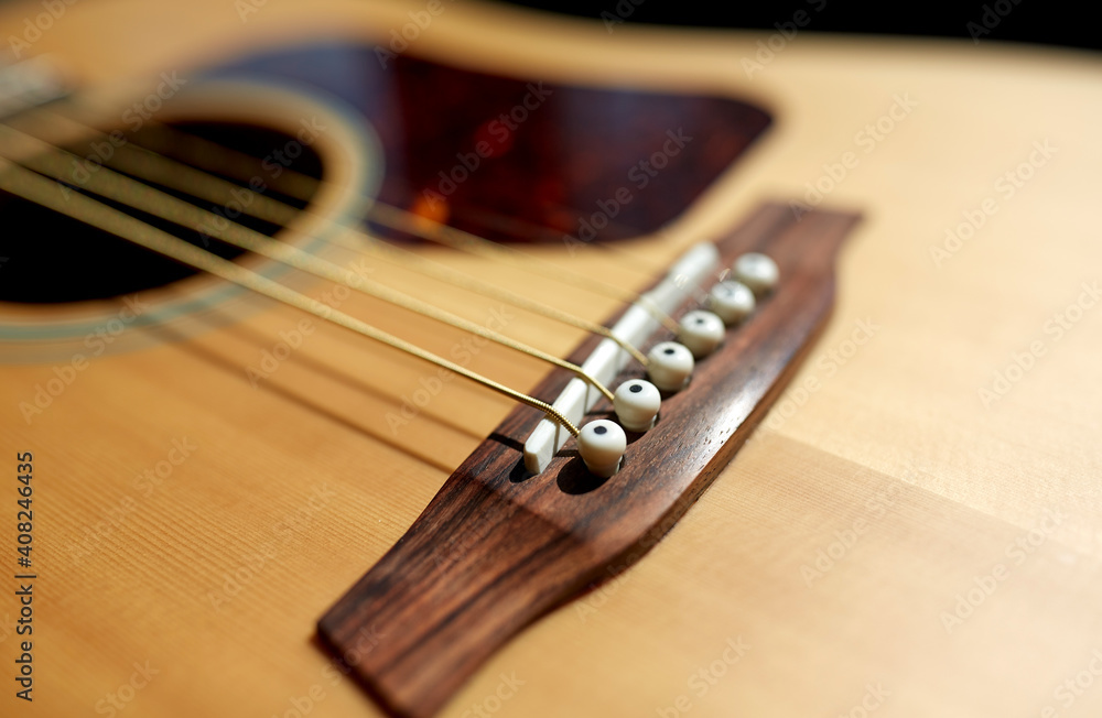 Fototapeta premium leisure, music and musical instruments concept - close up of acoustic guitar strings