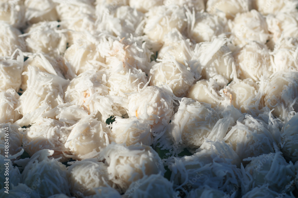 Boiled dessert, stuffed dessert filled with sweet, delicious, soft dough Covered with young coconut meat. It is a popular dessert in Thailand. Boiled dessert, stuffed dessert filled with sweet, delicious, soft dough Covered with young coconut meat. It is a popular dessert in Thailand.