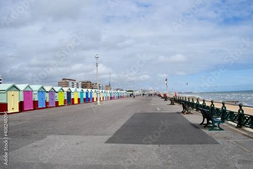 Row of colourful beach huts on Hove seafront, UK