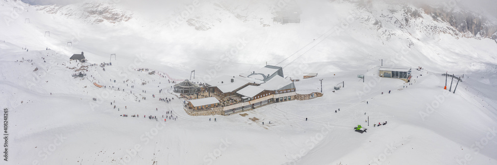 Panoramic aerial view of Sonnalpin restaurant in heavy snow below Zugspitze Top of Germany