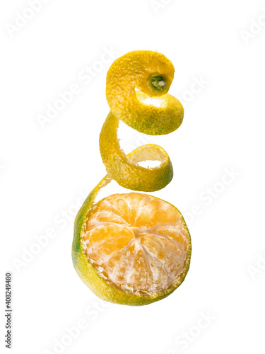 Fresh ripe green mandarine with spiral zest. Half peeled green tangerine isolated on white background with clipping path photo