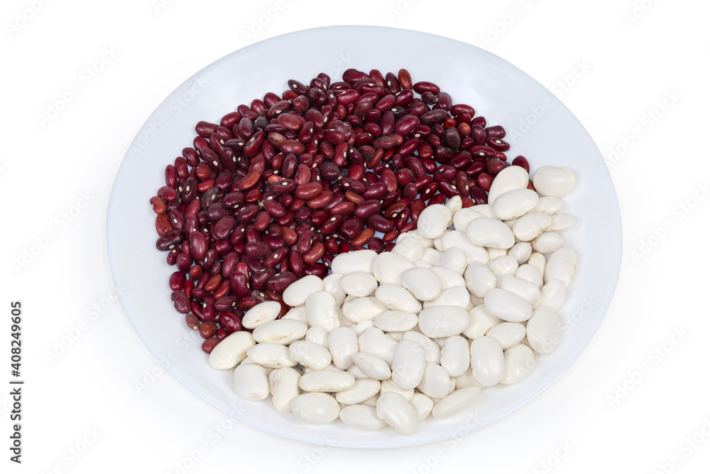 Raw white and red kidney beans on a white dish Raw white and red kidney beans on a white dish