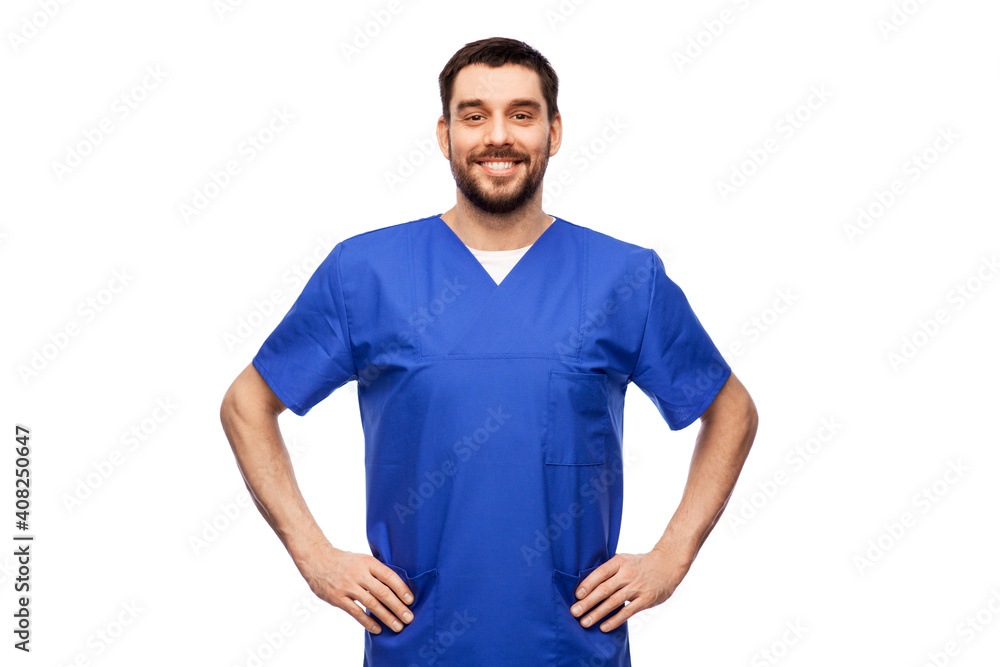 healthcare, profession and medicine concept - happy smiling doctor or male nurse in blue uniform over white background healthcare, profession and medicine concept - happy smiling doctor or male nurse in blue uniform over white background