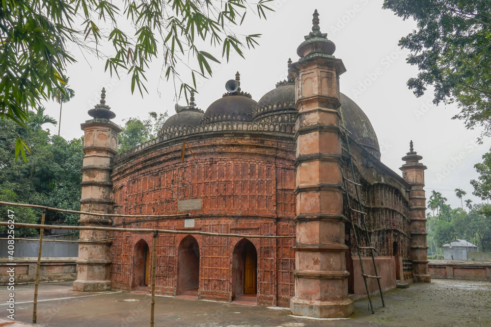 Side view of ancient Atiya or Atia mosque with stunning terracotta facade in Tangail district, Bangladesh