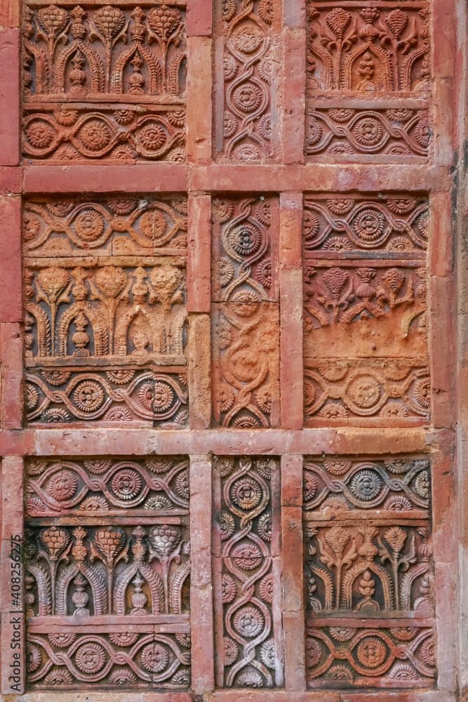 Detail of stunning intricate terracotta carving with floral and geometric pattern on the facade of ancient Atiya or Atia mosque in Tangail district, Bangladesh