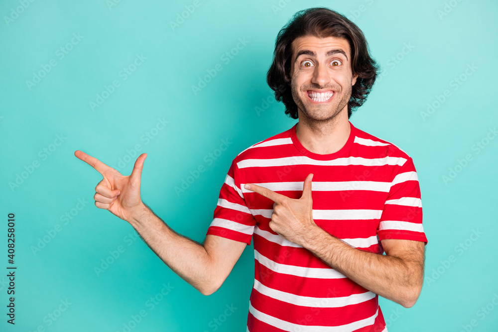 Portrait of nice funky cheerful content guy demonstrating copy space advert isolated over bright green turquoise color background Portrait of nice funky cheerful content guy demonstrating copy space advert isolated over bright green turquoise color background