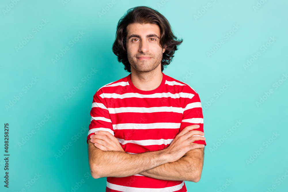 Fototapeta premium Portrait of nice content brown-haired guy folded arms isolated over bright green turquoise color background
