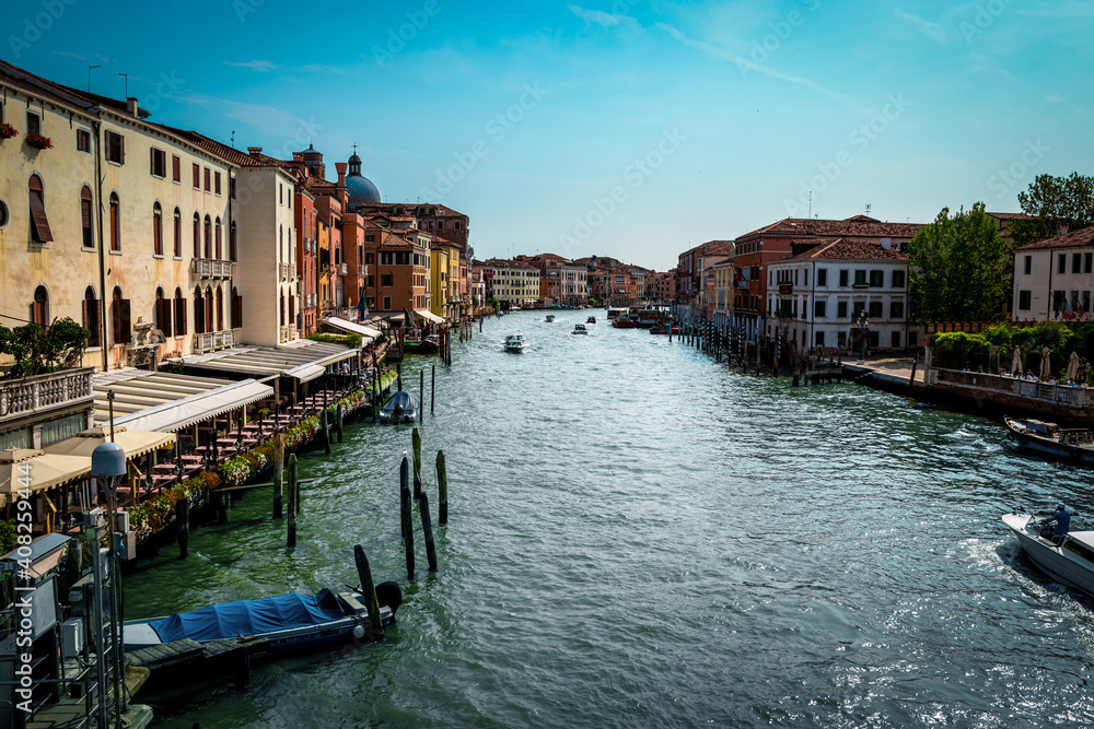 the grand canal of venice in the afternoon. picture from the bridge to the grand canal. motor boats sail along the grand canal