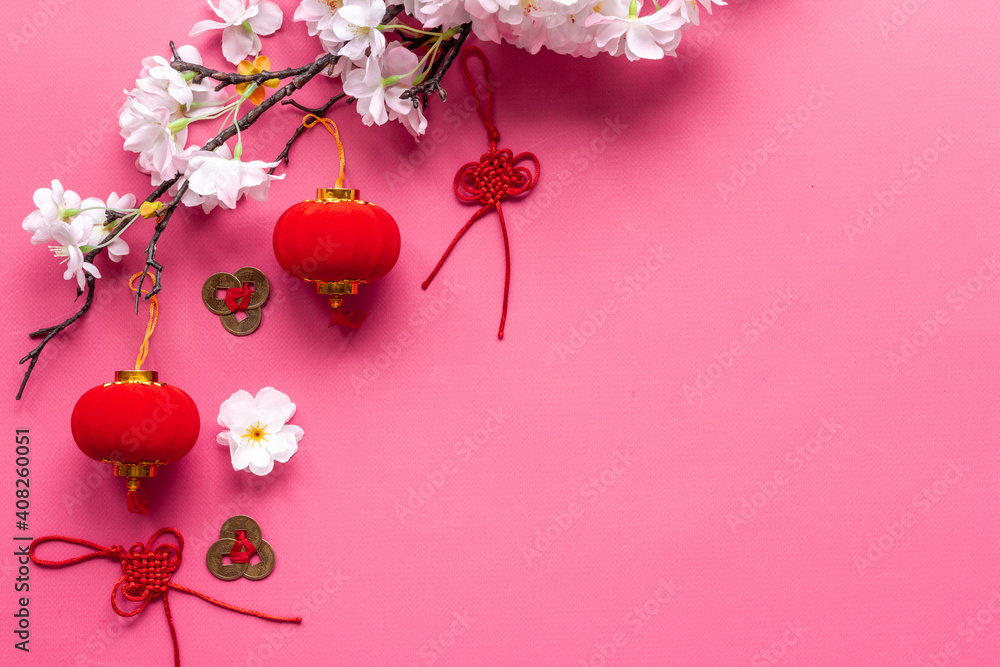 Chinese new year flat lay. Decoration with cherry flowers, red lanterns and knots