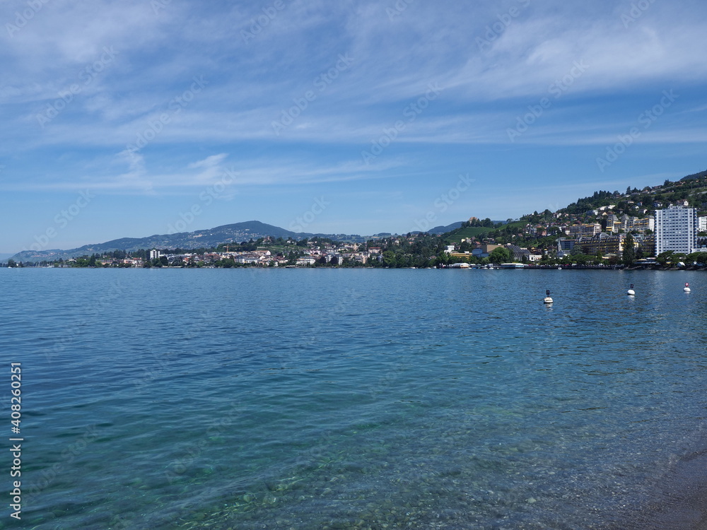 Famous view of Lake Geneva and european Montreux city in canton Vaud in Switzerland, clear blue sky in 2017 warm sunny summer day on July.