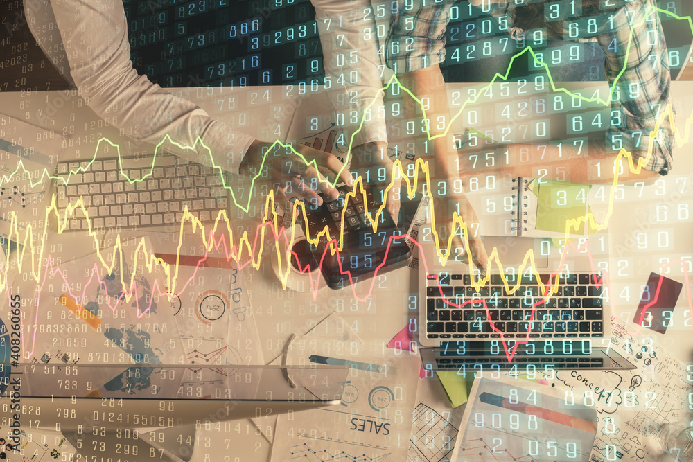 Double exposure of man and woman working together and financial graph hologram drawing. market analysis concept. Computer background. Top View. Double exposure of man and woman working together and financial graph hologram drawing. market analysis concept. Computer background. Top View.