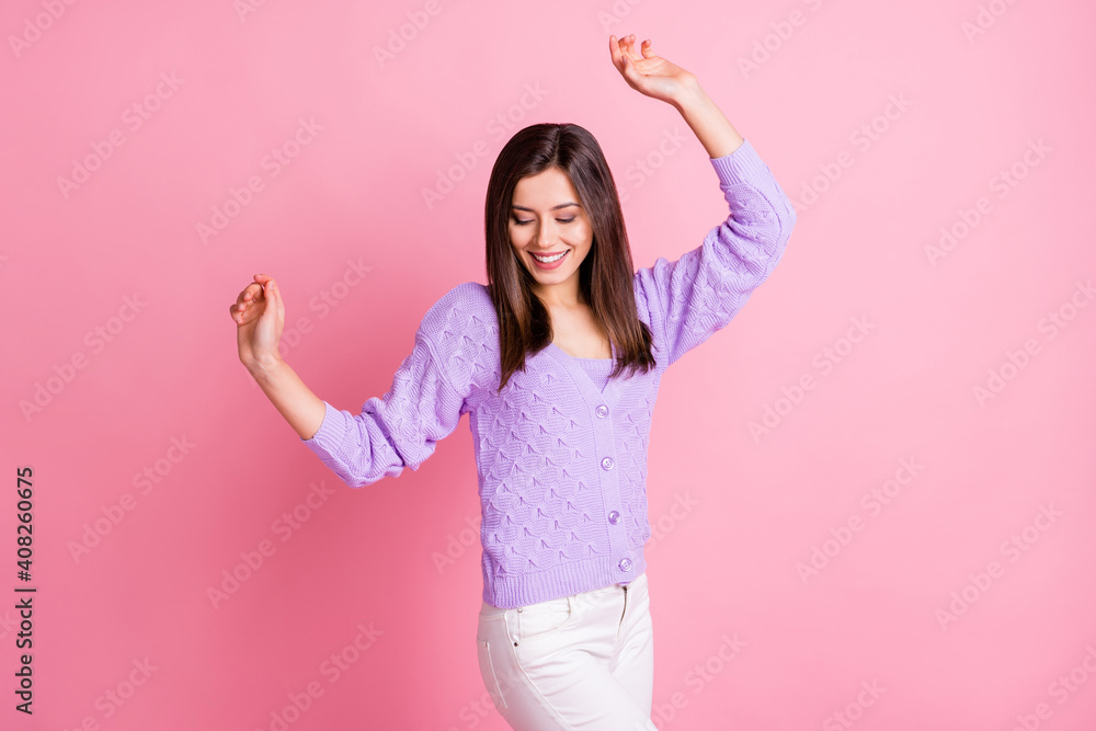 Photo of young attractive girl happy smile have fun enjoy music dance isolated over pink color background Photo of young attractive girl happy smile have fun enjoy music dance isolated over pink color background