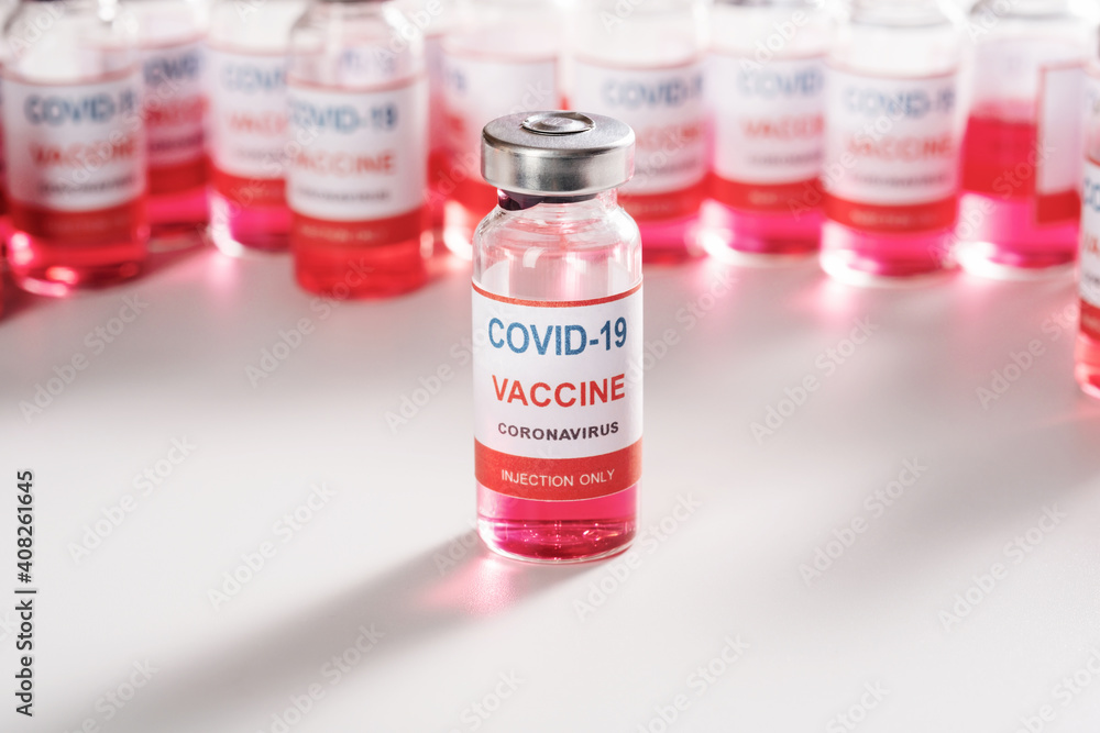 glass vaccine vial for vaccination against COVID-19 SARS-CoV-2 coronavirus pandemic on white background glass vaccine vial for vaccination against COVID-19 SARS-CoV-2 coronavirus pandemic on white background