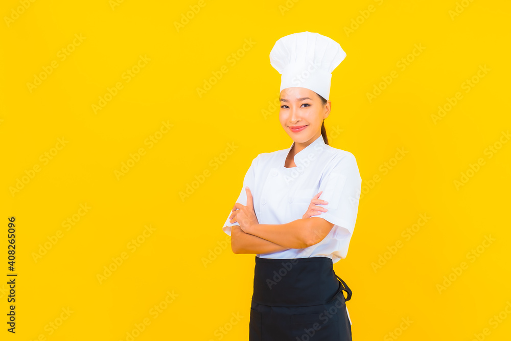 Portrait beautiful young asian woman in chef or cook uniform with hat Portrait beautiful young asian woman in chef or cook uniform with hat