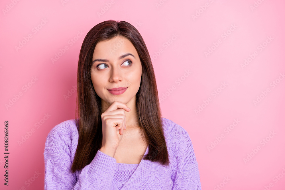 Portrait of optimistic nice girl look empty space wear lilac sweater isolated on pink color background Portrait of optimistic nice girl look empty space wear lilac sweater isolated on pink color background