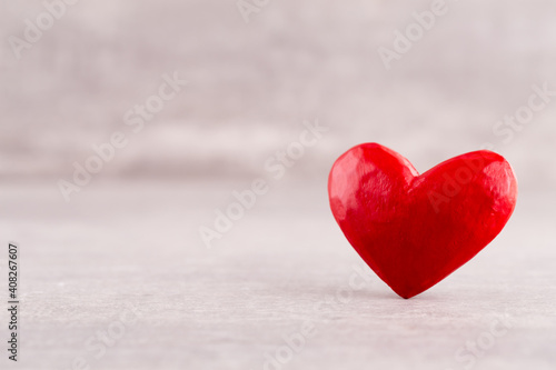 Red heart, valentine day greeting card. Wooden hearts background.