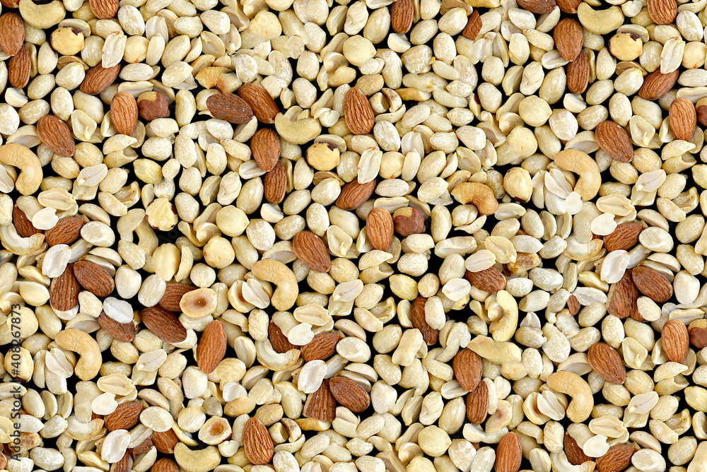 Pile of mixed nuts of almond, hazelnut, peanut and cashew Pile of mixed nuts of almond, hazelnut, peanut and cashew