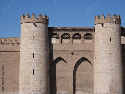 Walls with towers of palace in european Saragossa city at Aragon district in Spain, clear blue sky in 2019 warm sunny summer day on September.