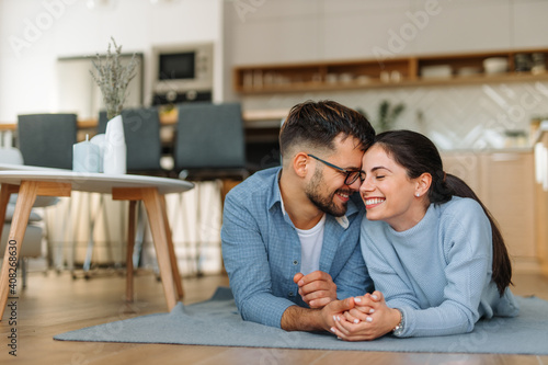 Living together, modern kitchen in the background.