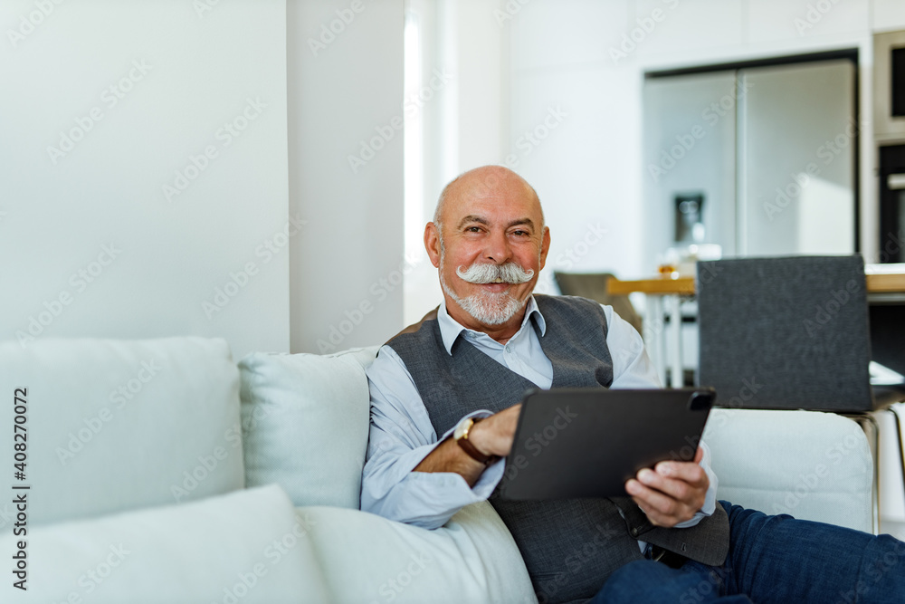 Mature man using modern technology. Mature man using modern technology.