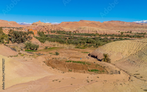 Amazing panoramic view of the stunning town of Aid Ben Haddou in the Moroccan desert with the Atlas Mountain Range in the background