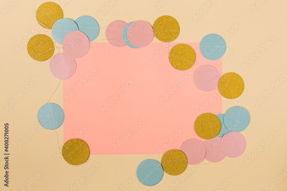 Minimal concept of ballon shape circles surrounding paper card in the middle. Pink copy space with pastel beige background. Minimal concept of ballon shape circles surrounding paper card in the middle. Pink copy space with pastel beige background.
