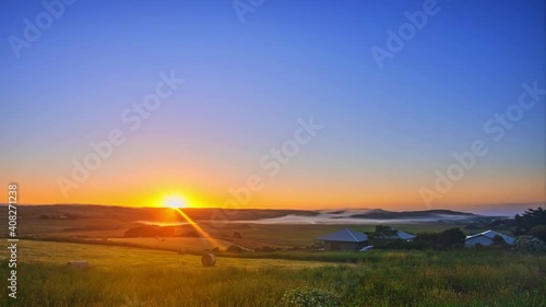 Wallpaper Mural Time-lapse of village at sunrise in autumn, farmland and houses after harvest Torontodigital.ca