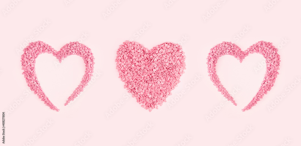 Heart shape candy pink hearts background of cake sprinkles in flat lay with copy space, feminine blogger or festive love gift and Valentine's Day concept. banner mockup. Small hearts minimal