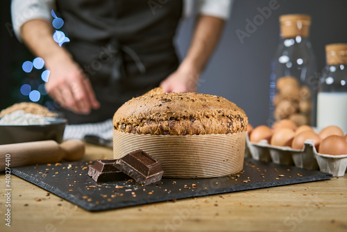 Healthy and nutritious breakfast or snack with a slice of homemade cereal sweet bread. The baked cake is made from flour, eggs, cereals, oats, spelled, barley and chocolate.